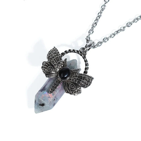Necklace with a crystal pendant and black stone on a white background