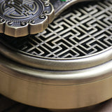 Close-up of a metallic object with intricate design and emblem
