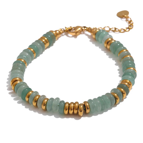 Bracelet with alternating green beads and gold accents on a white background