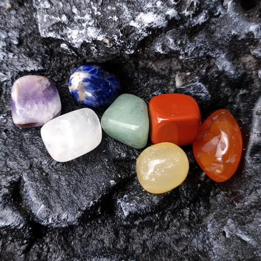 Colorful crystals on a dark stone surface
