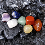 Colorful crystals on a dark stone surface