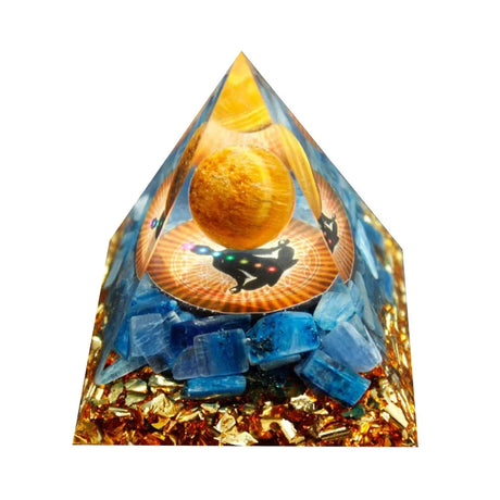 Pyramid-shaped object with blue stones and a circular design on a white background
