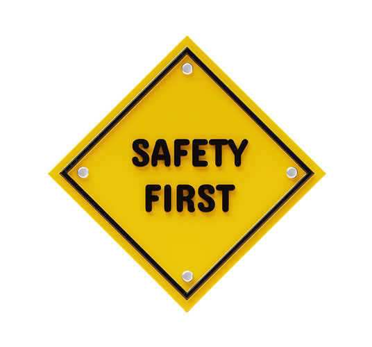 Yellow diamond-shaped safety sign with 'SAFETY FIRST' text on a white background