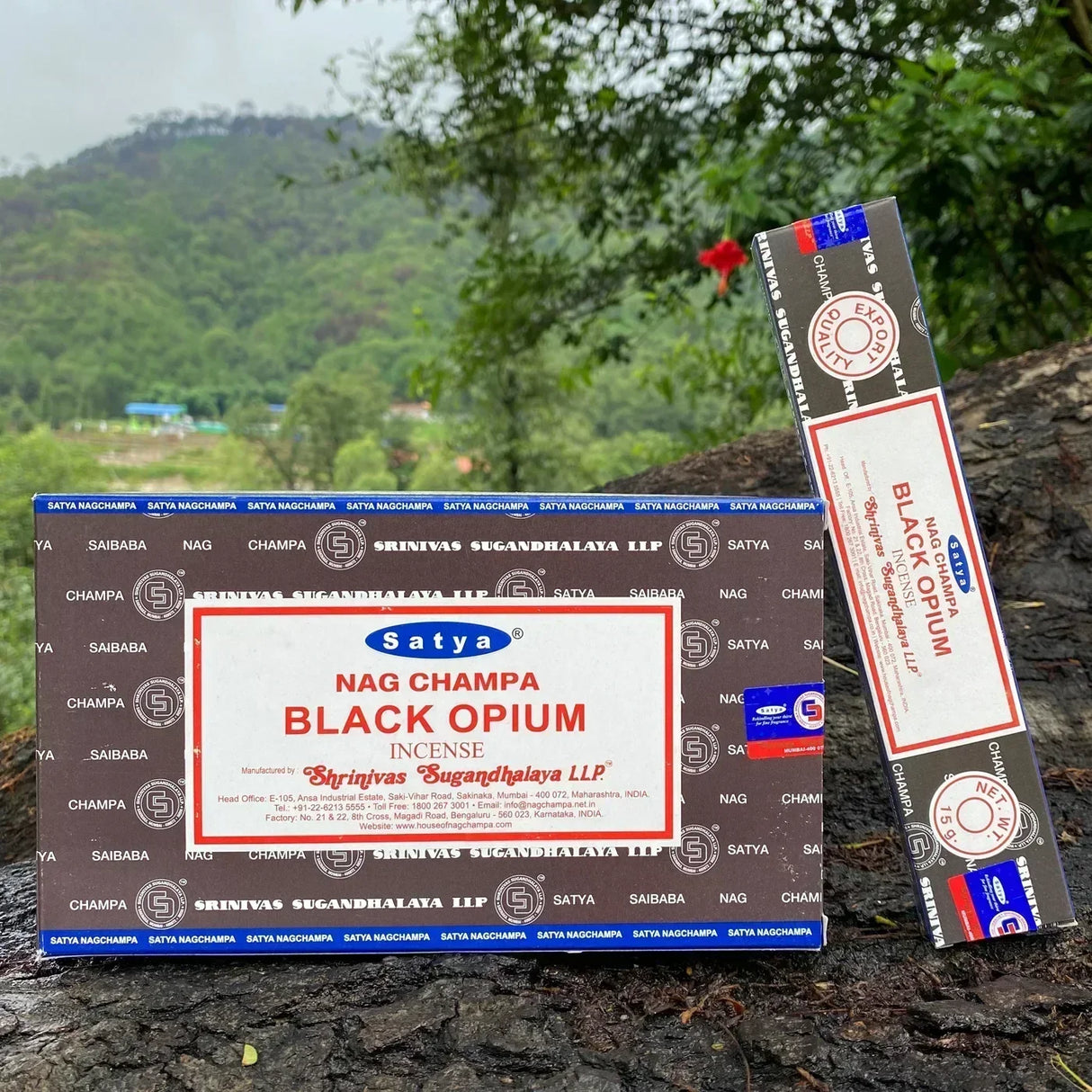 Satya Nag Champa Black Opium incense packaging on a natural background