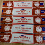 Multiple boxes of Satya Nag Champa Yogic Meditation Incense on a wooden surface