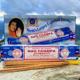 Satya Nag Champa incense sticks with packaging against a natural background