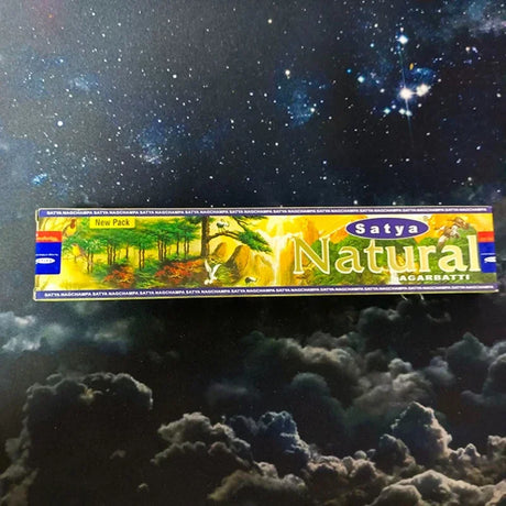 Satya Natural incense stick box with a space-themed background