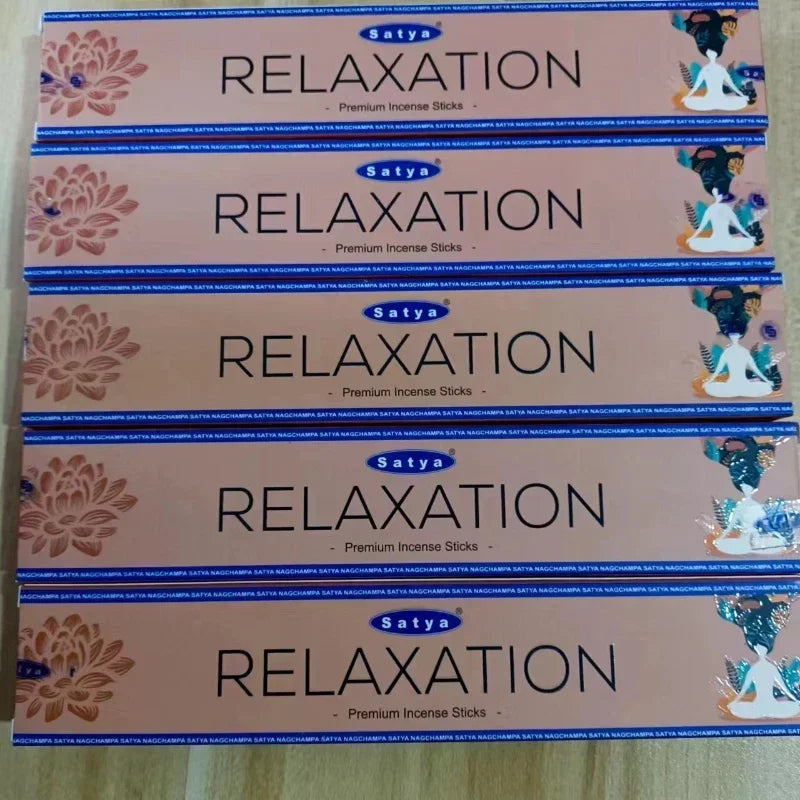Multiple boxes of Satya Relaxation incense sticks on a light background