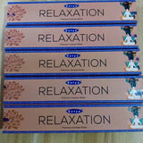 Multiple boxes of Satya Relaxation incense sticks on a light background