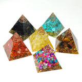 Set of colorful pyramid-shaped decorative items on a white background