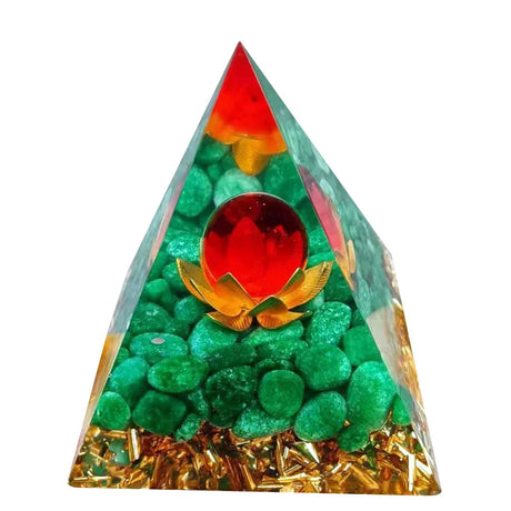 Triangular pyramid with green stones, red ball, and gold accents on a white background
