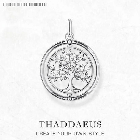 Silver tree of life pendant on a white background with 'Thaddaeus' branding.