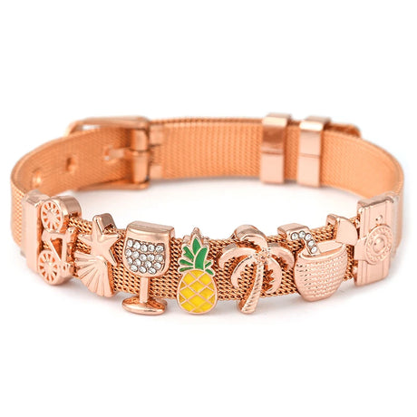 Rose gold dog collar with various charms on a white background