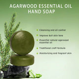 Green agarwood essential oil hand soap with natural elements on a green background