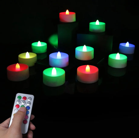 Colorful LED candles with a remote control on a dark background