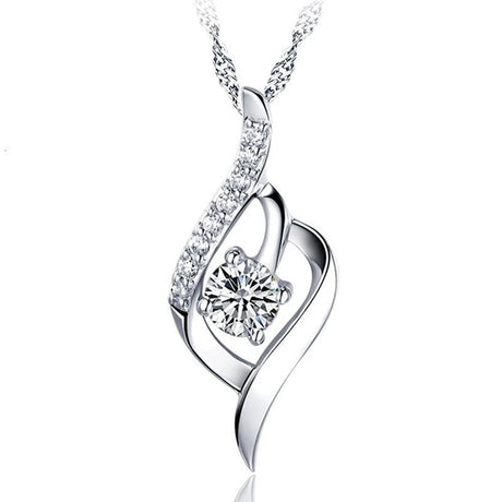 Silver necklace with a heart-shaped pendant and diamond on a white background, featuring the brand 'ZDADAN'.