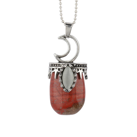 Necklace with a red stone pendant and silver crescent moon design on a white background