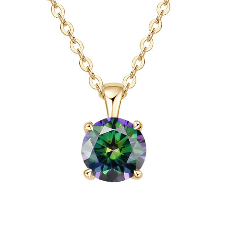 Gold necklace with a green gemstone pendant on a white background
