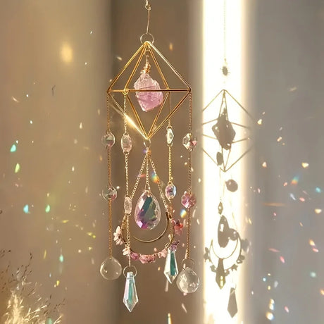 Decorative hanging crystal mobile with colorful stones against a soft background