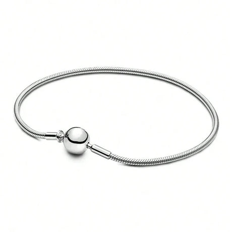 Silver bracelet with a round clasp on a white background