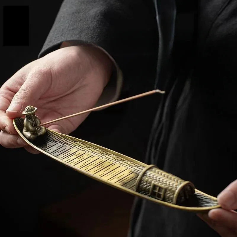 Person holding a traditional bow with a dark background