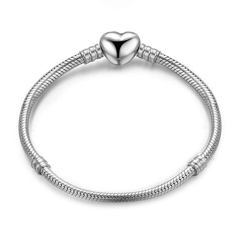 Silver bracelet with a heart-shaped clasp on a white background