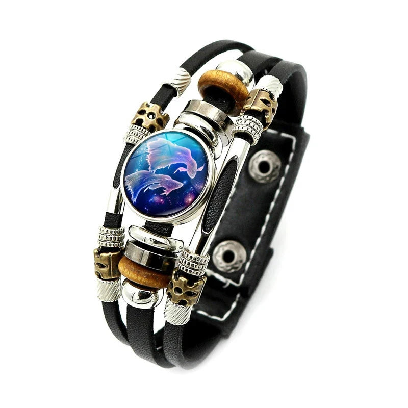 Multistrand bracelet with leather and metal components on a white background