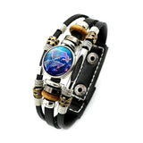 Multistrand bracelet with leather and metal components on a white background