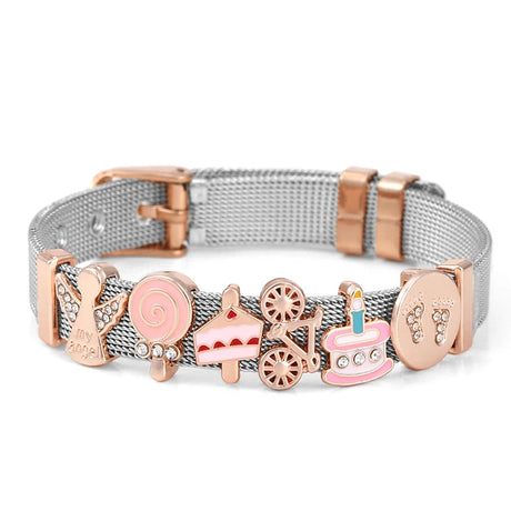 Silver and rose gold bracelet with various charms on a white background