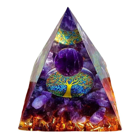 Triangular pyramid with purple crystal ball and colorful tree design on a white background