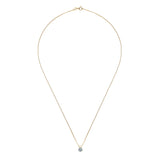 Gold necklace with a small pendant on a white background