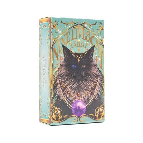 Cardboard box with a cat illustration and 'Nine Lives Tarot' text on a light blue background
