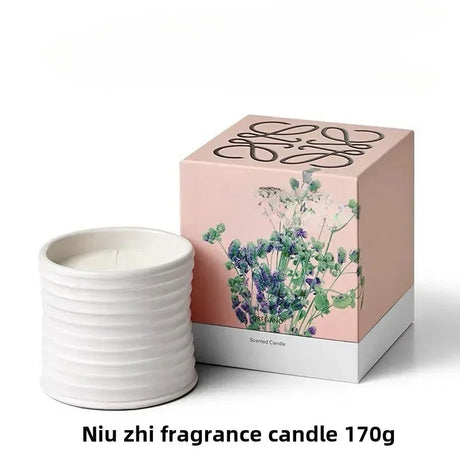 White fragrance candle with a decorative box on a white background