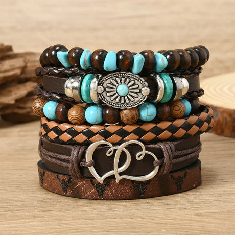 Stack of leather and beaded bracelets with decorative elements on a wooden surface