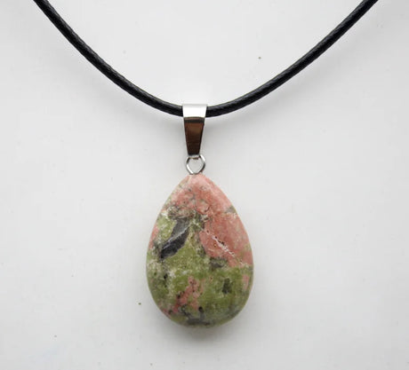 Necklace with a teardrop-shaped gemstone pendant on a white background