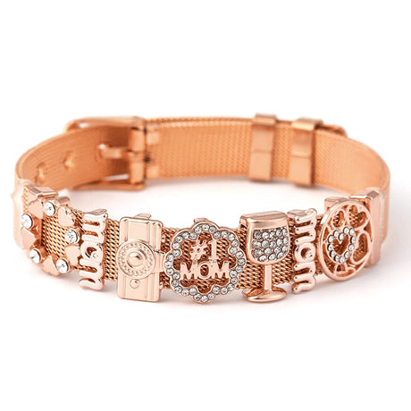 Rose gold dog collar with various charms on a white background
