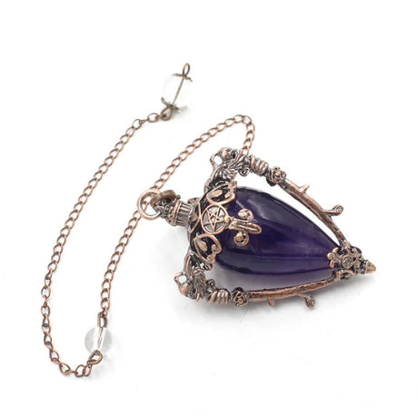 Purple teardrop pendant with intricate gold detailing on a white background