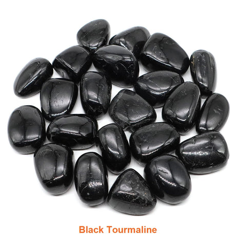 Collection of black tourmaline stones on a white background