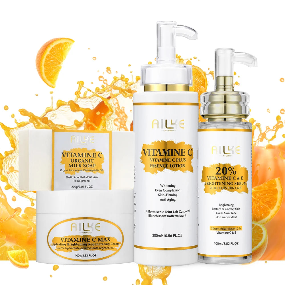 Set of skincare products with orange slices on a white background