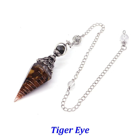 Tiger eye crystal pendant on a chain with a white background