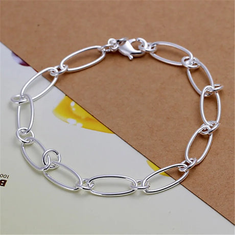 Silver chain bracelet on a textured surface