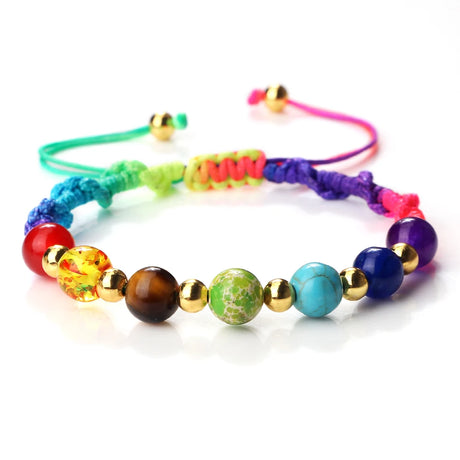 Colorful beaded bracelet with various beads on a white background