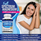 Woman sitting on a couch with a bottle of magnesium supplement in front of her.
