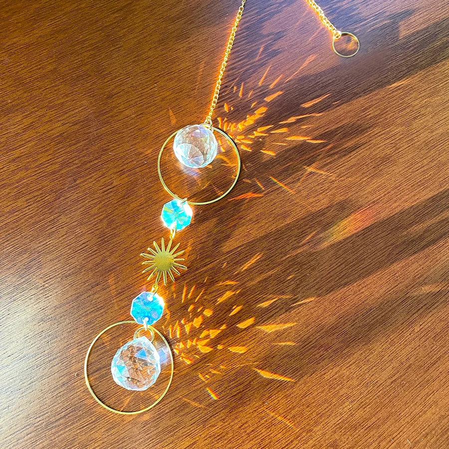 Necklace with crystal pendants on a wooden surface