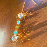 Necklace with crystal pendants on a wooden surface