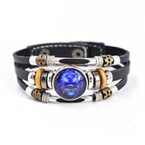 Multistrand bracelet with a central blue stone on a white background