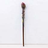 Decorative wand with intricate design on a white background