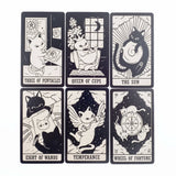 Set of tarot cards with cat illustrations and astrological symbols on a white background