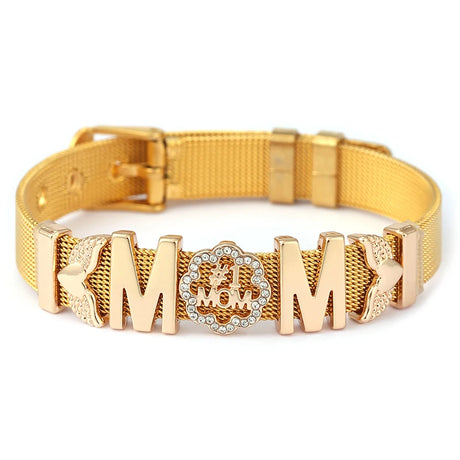 Gold dog collar with 'MOM' engraving on a white background