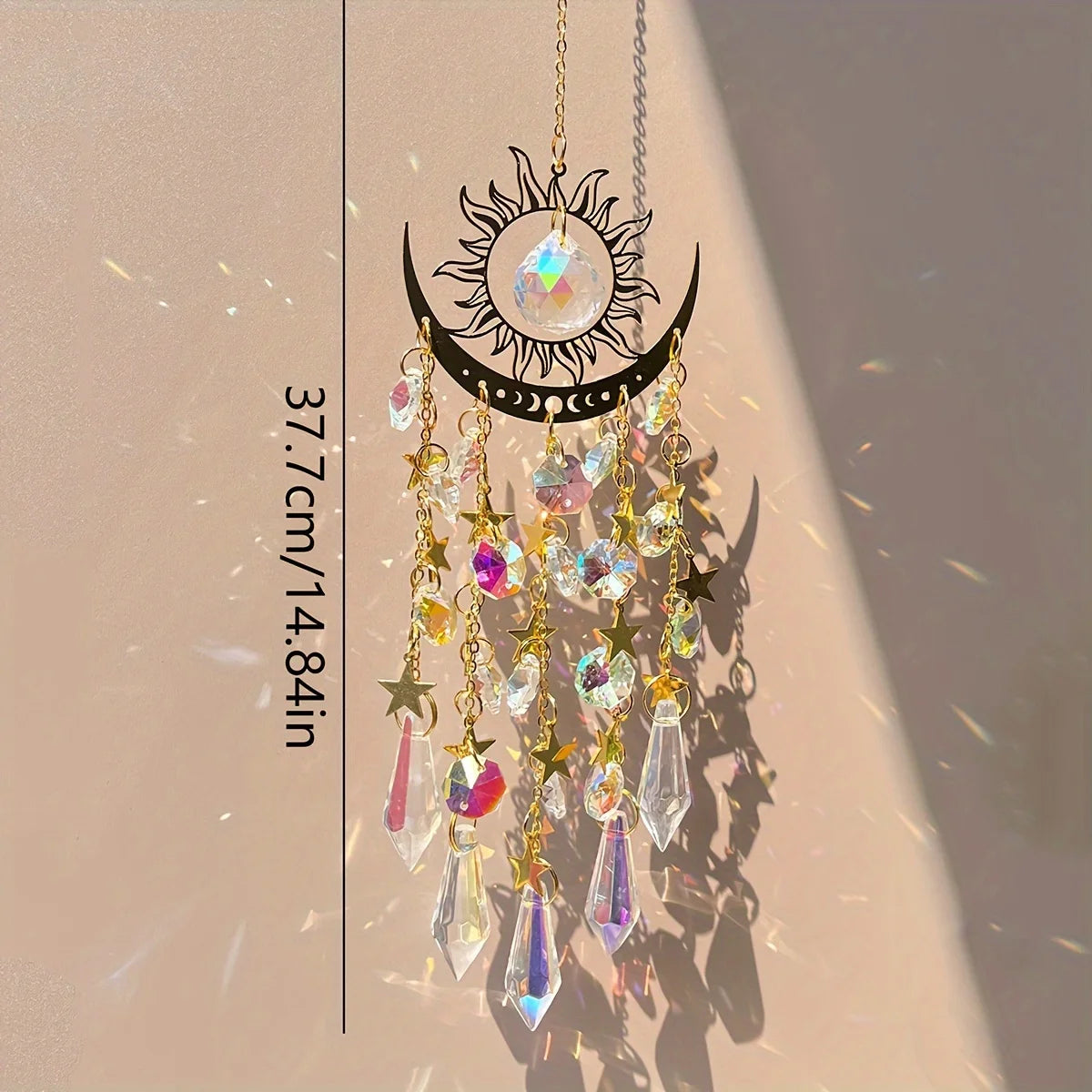 Decorative hanging ornament with crystals and celestial design on a beige background